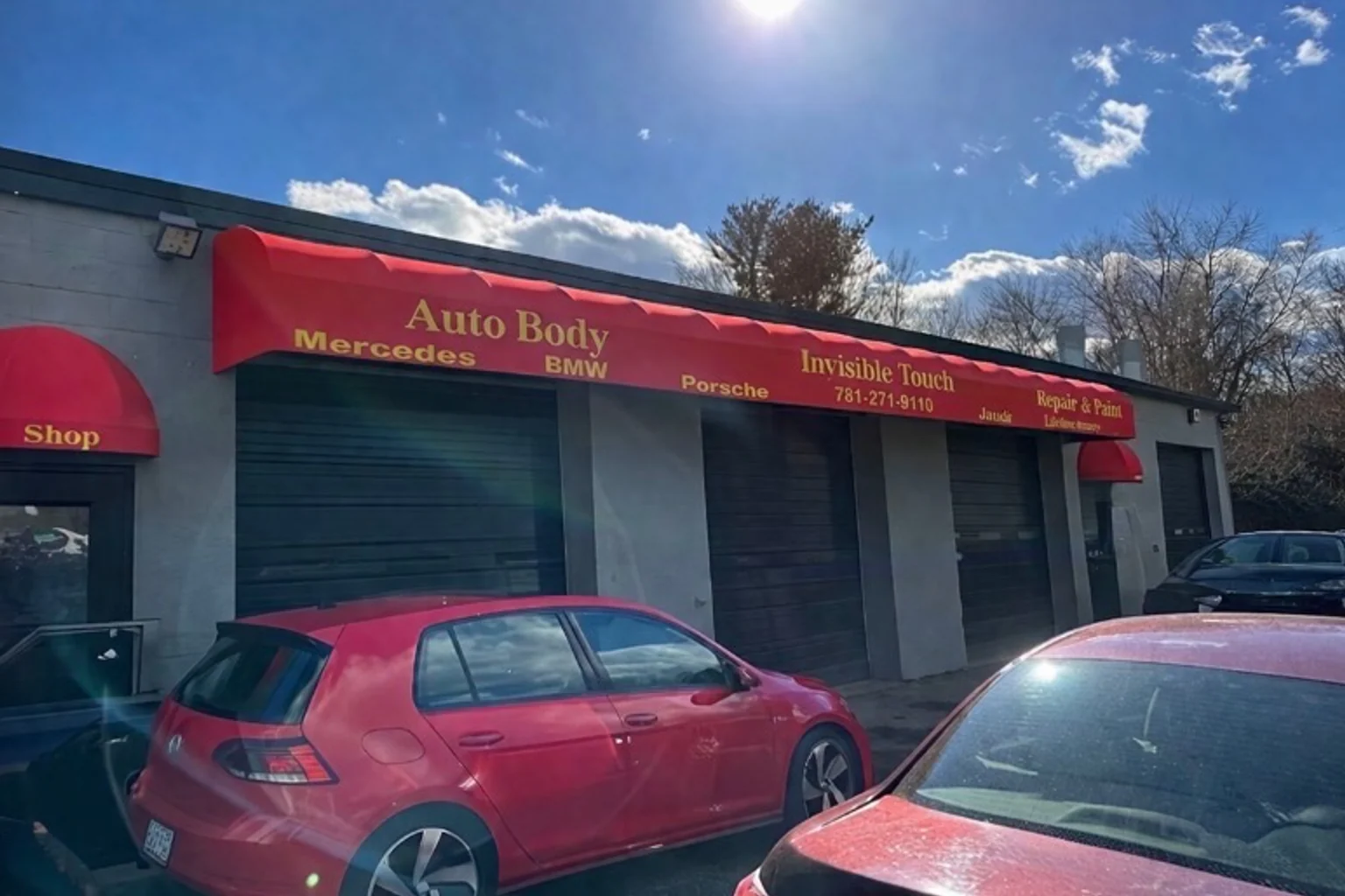 Exterior of the Invisible Touch auto body repair facility in Bedford, Massachusetts