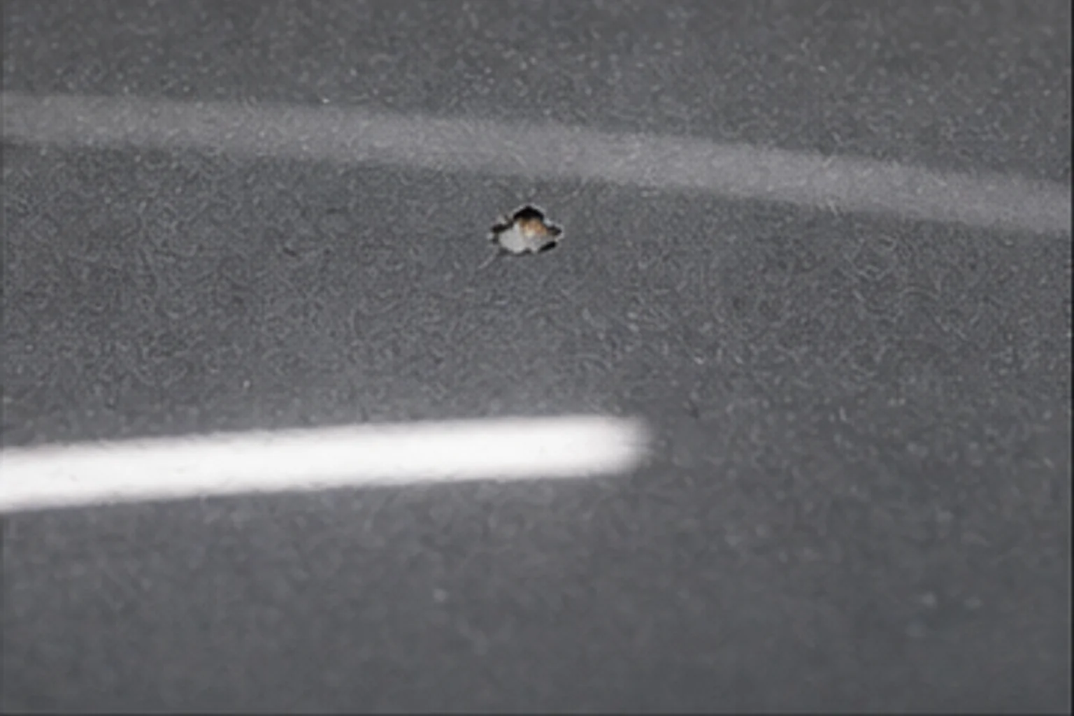 Stone chip impact zone — hood
