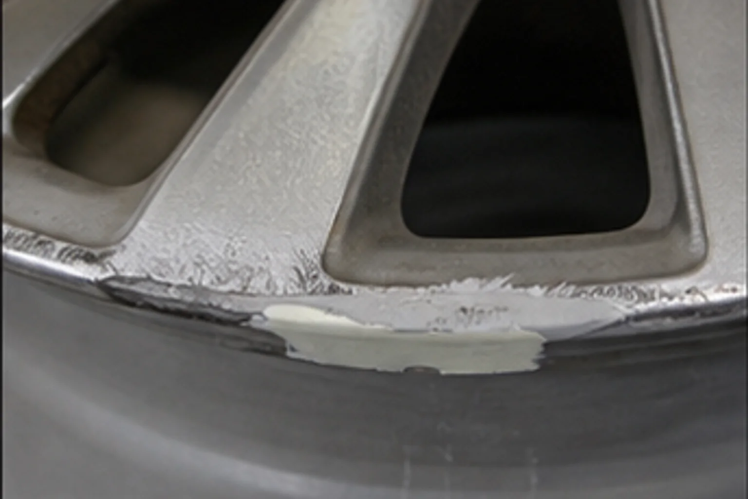 Curb rash — sanded and filled